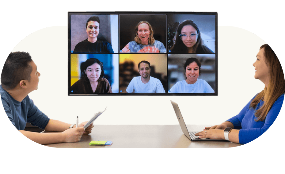 meeting room with employees on zoom call